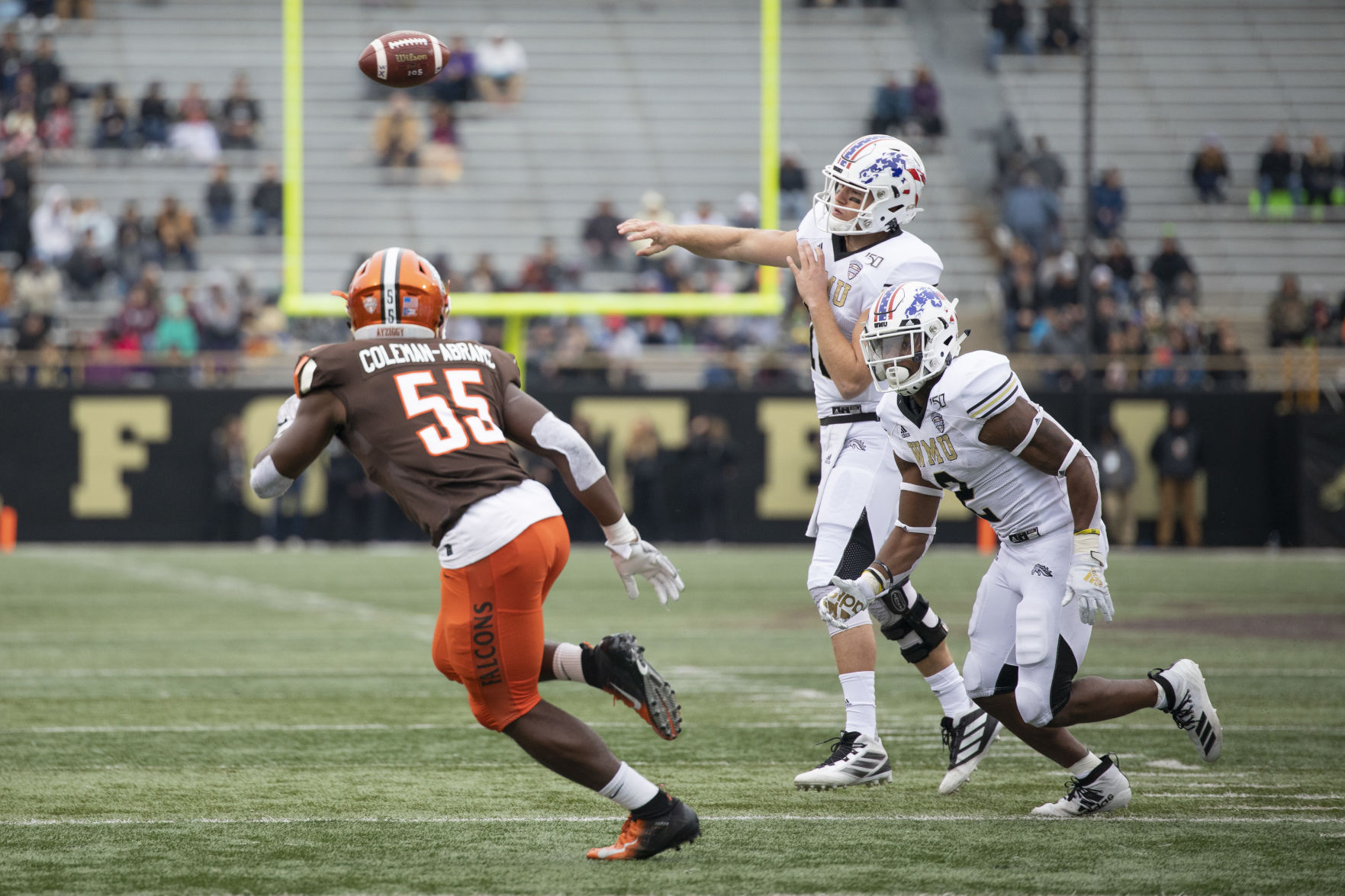 Jon Wassink is protected by LeVante Bellamy, (2) while being rushed by Bowling Green's Kholbe Coleman (55).